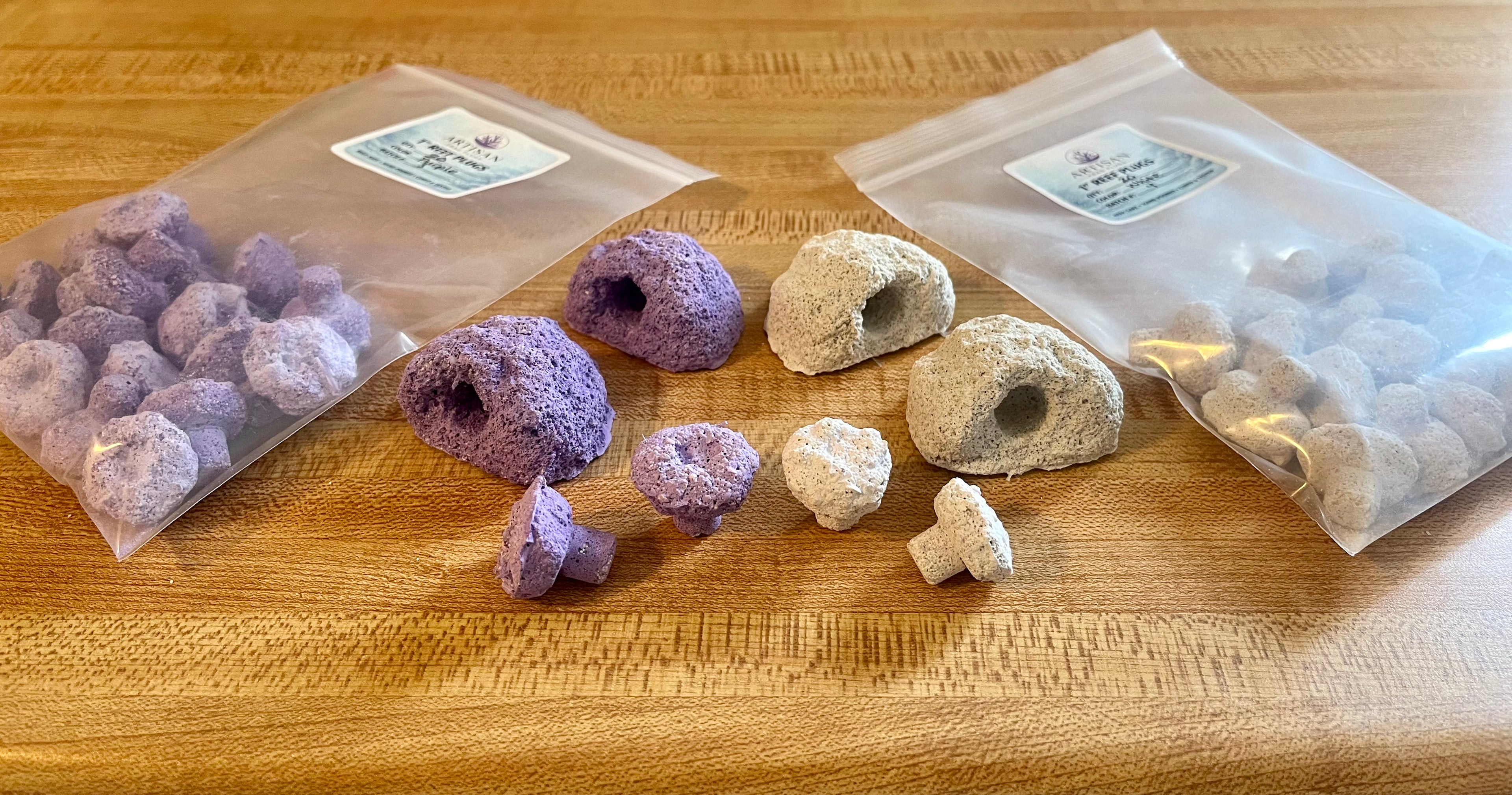 two packages of coral frag plugs and two sets of magnetic frag rocks